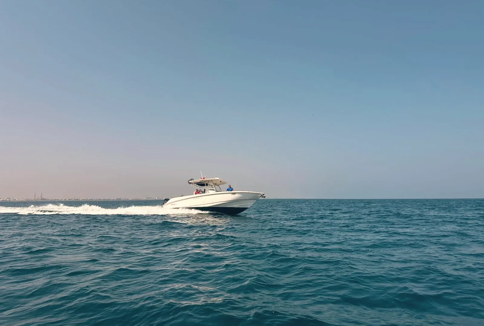 A Burmae boat under way on open water