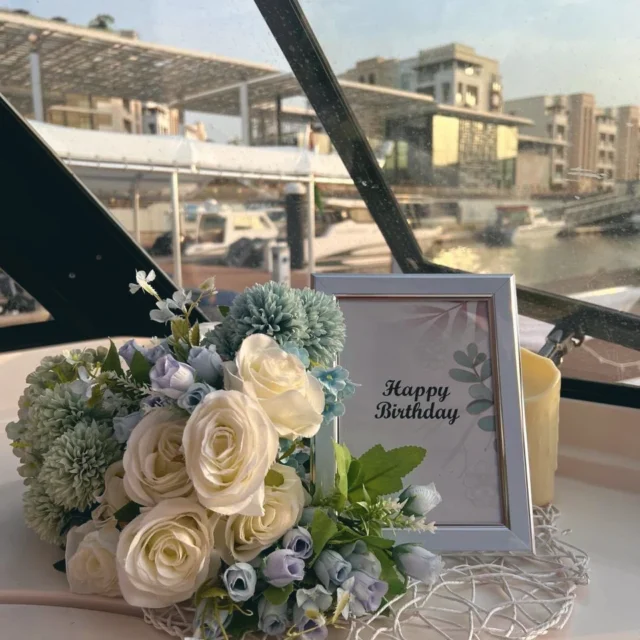 Flowers and a birthday frame on deck