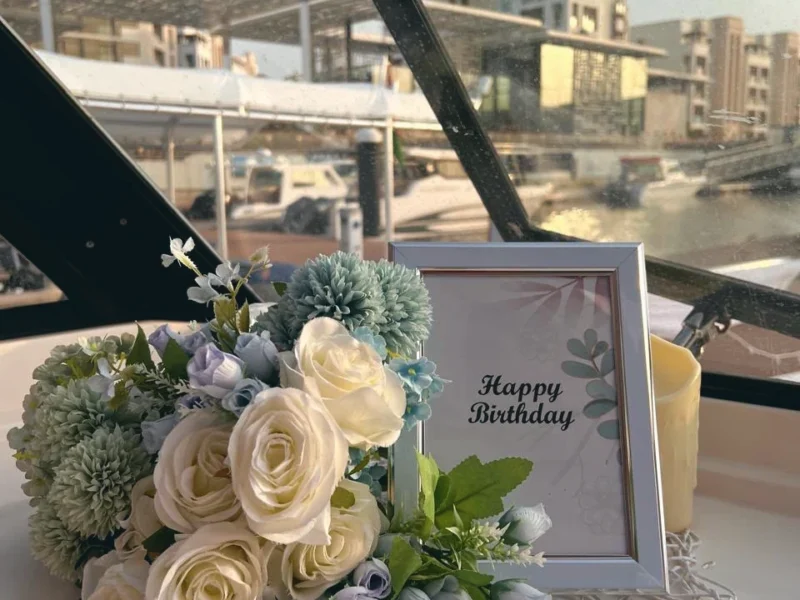 Flowers and a birthday frame on deck