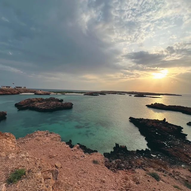 Sunset over rocky bays and clear water