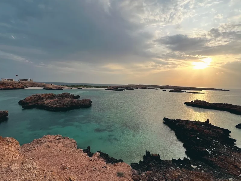 Sunset over rocky bays and clear water