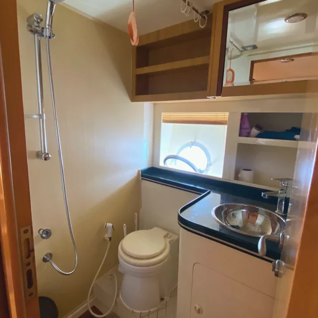 The yacht bathroom: shower, toilet and steel basin