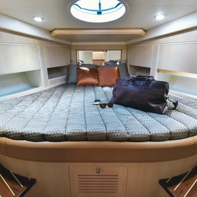 The master cabin: a large bed under a round skylight